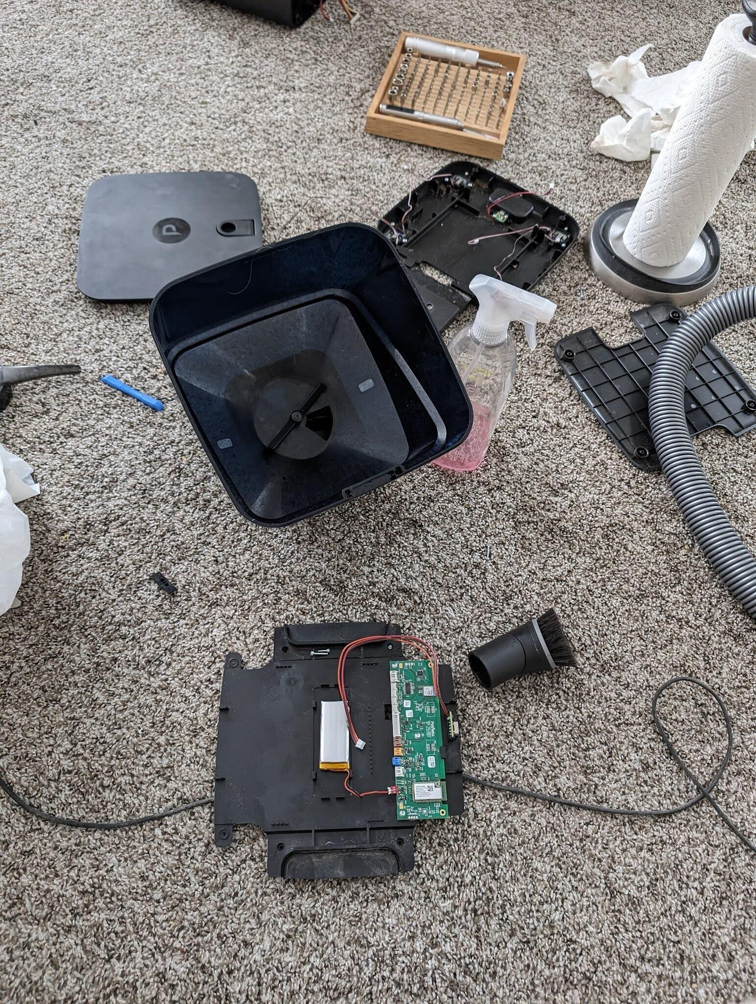 The guts of the cat feeder, opened for cleaning