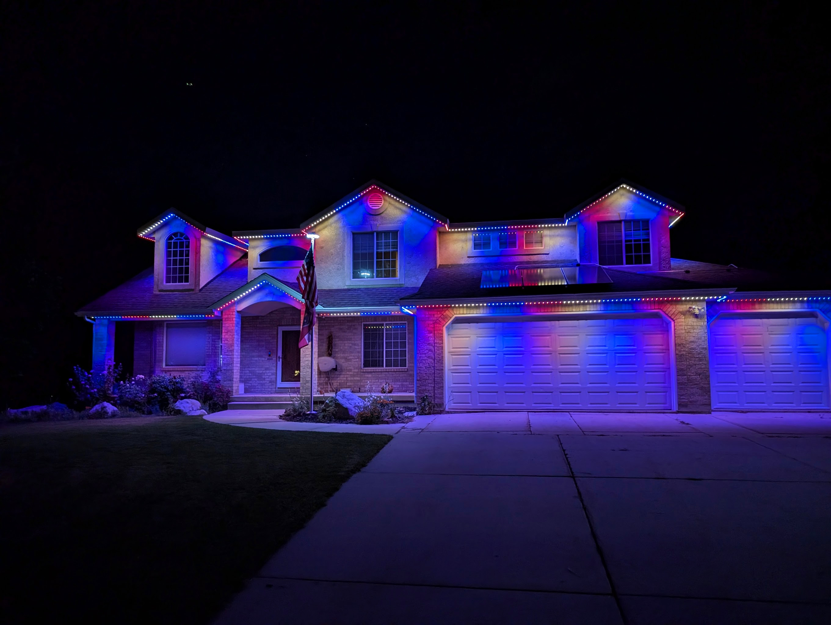 My house with Red White and Blue lights for the fourth of july