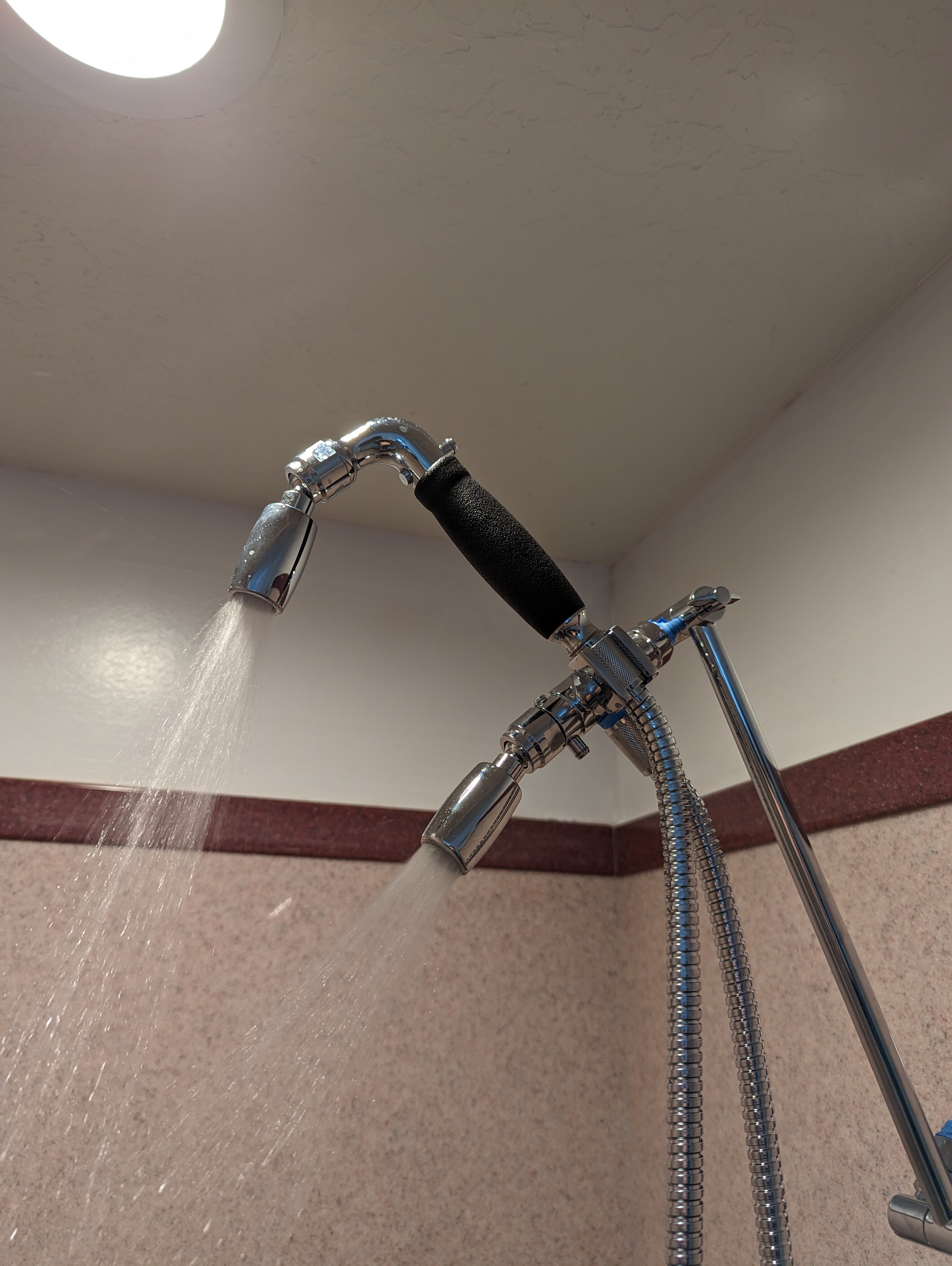 "master bath shower combo unit, showing two showerheads"